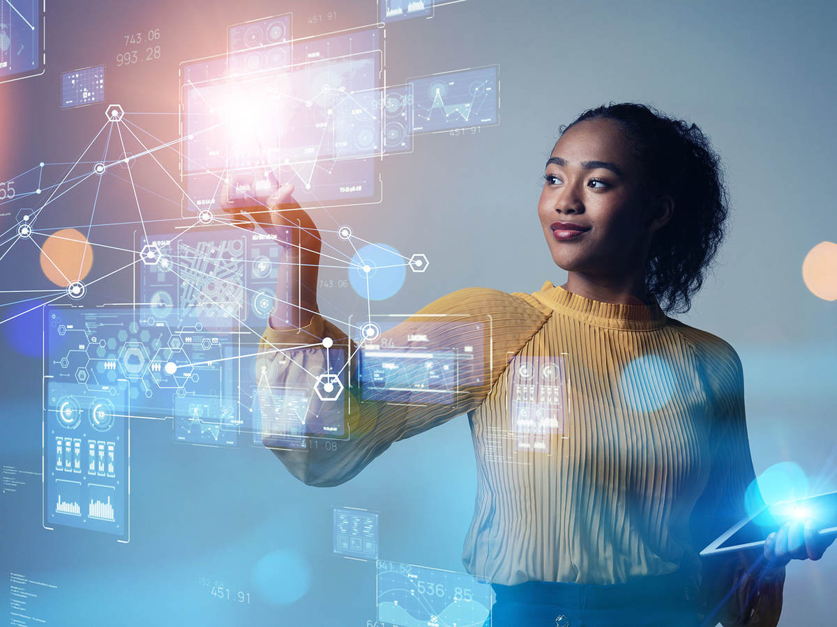 Person analyzing data on a futuristic screen