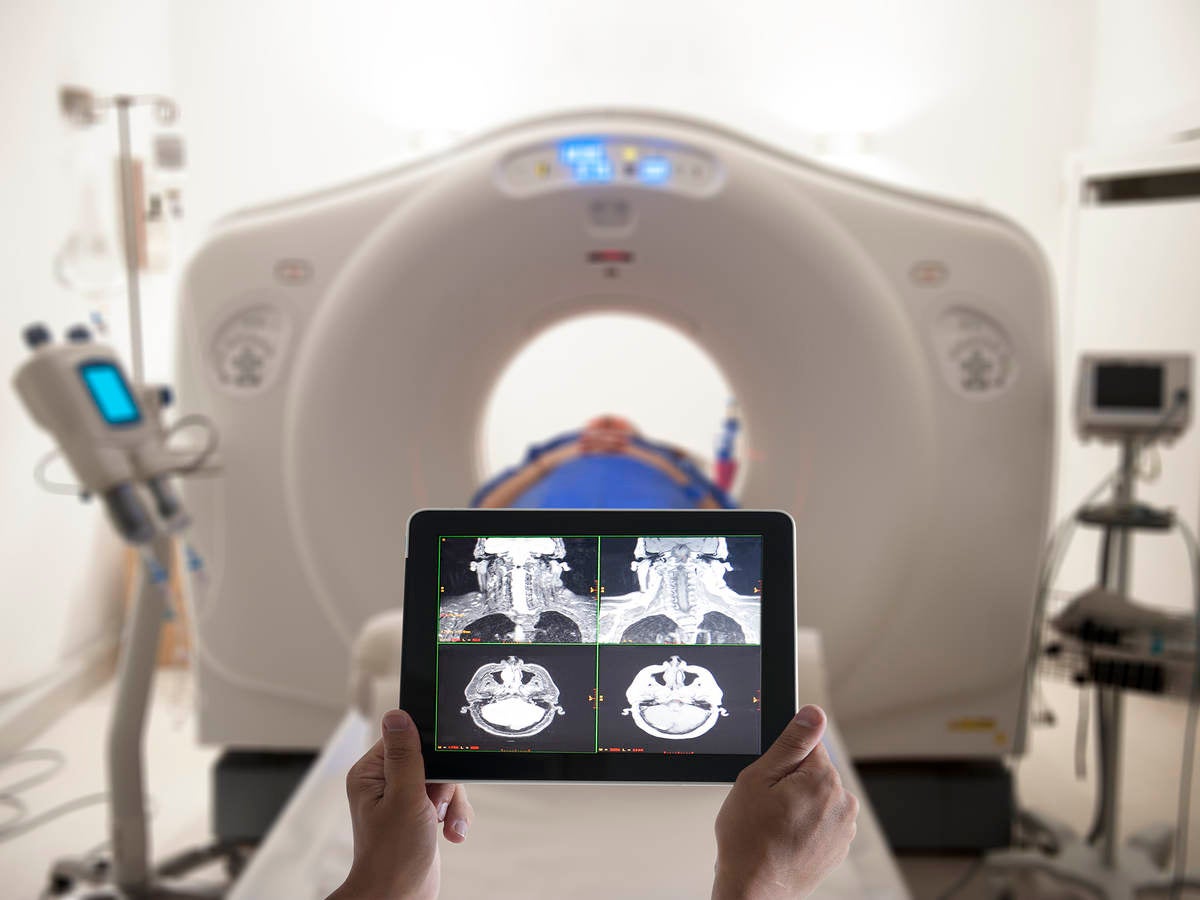 Doctor viewing MRI results on a tablet