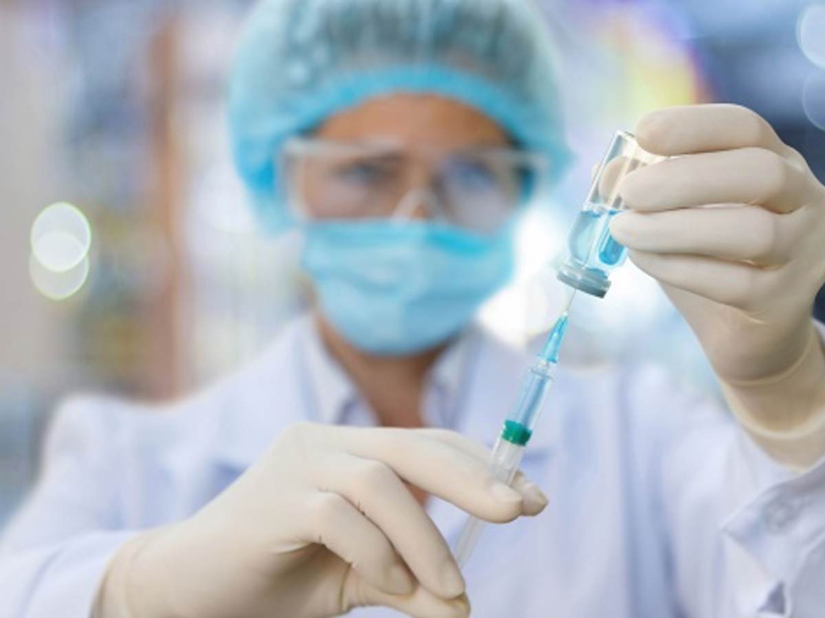 Nurse filling a syringe