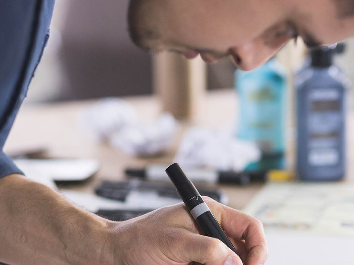 Person taking notes at a desk