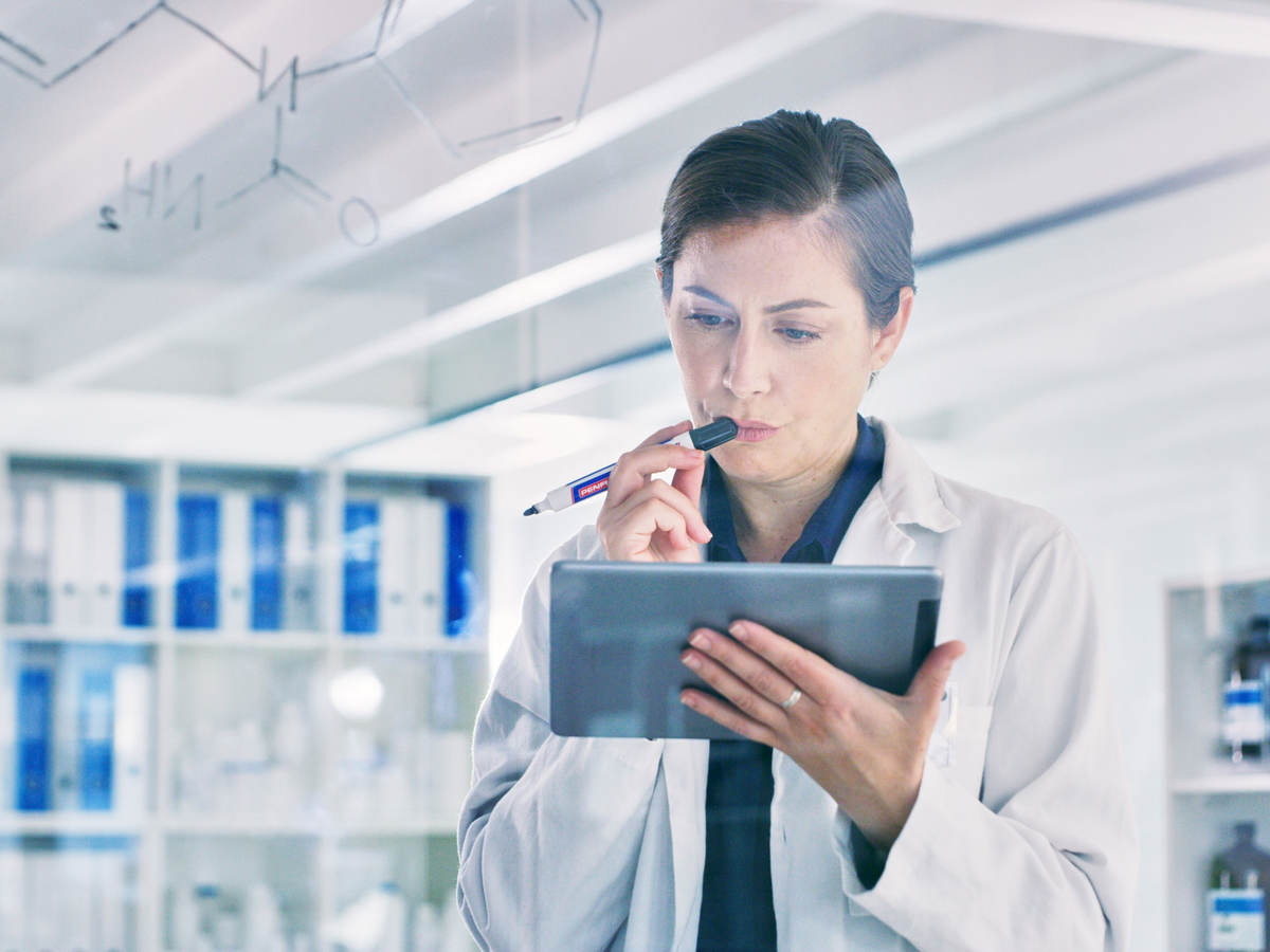 Scientist reviewing data on a tablet