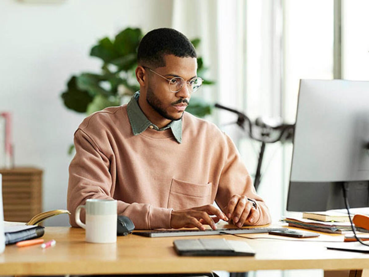 Person at computer attending a webinar