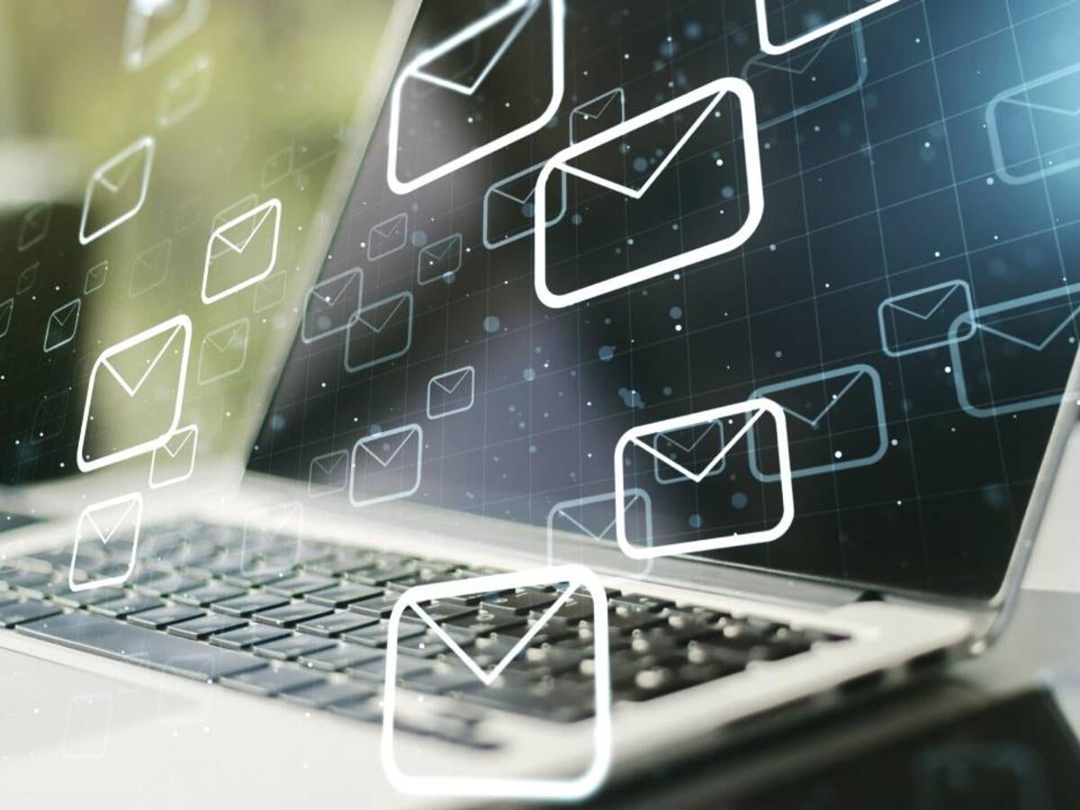 Laptop with email icons graphically overlaid