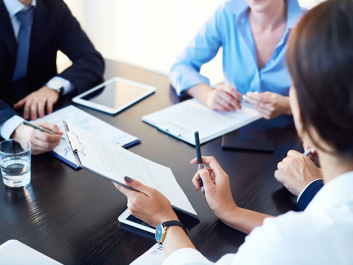 People having a meeting in a conference room