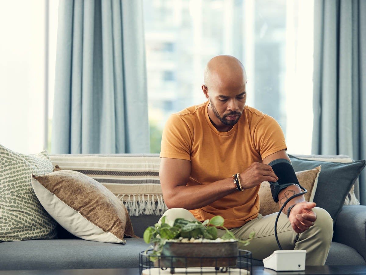 Man trying an at-home blood pressure device