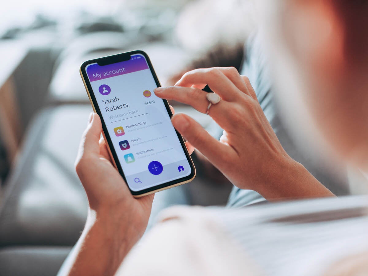 Man using lighted touchscreen on smartphone