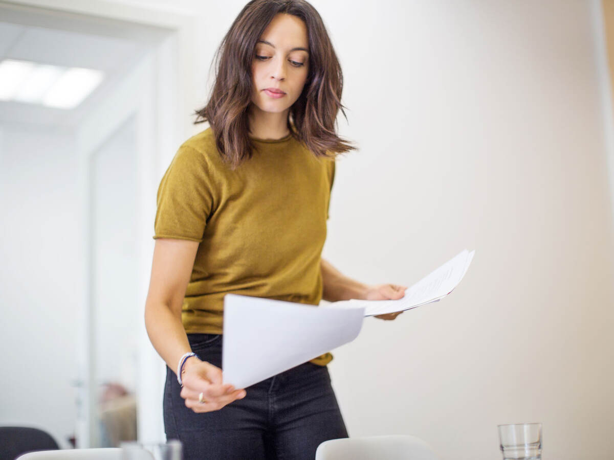 Person reviewing paperwork