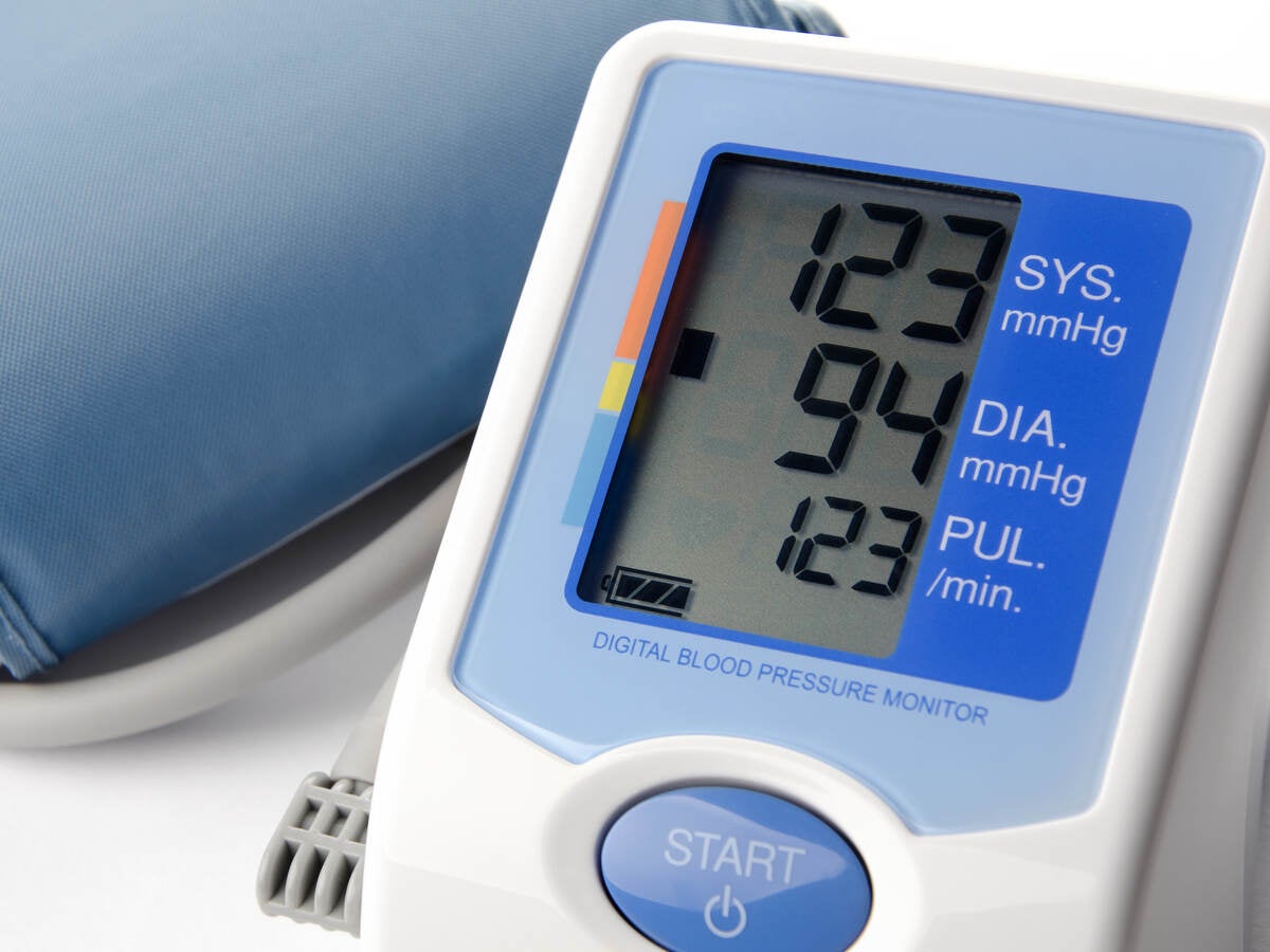 Picture of blood pressure monitor with a reading displayed.