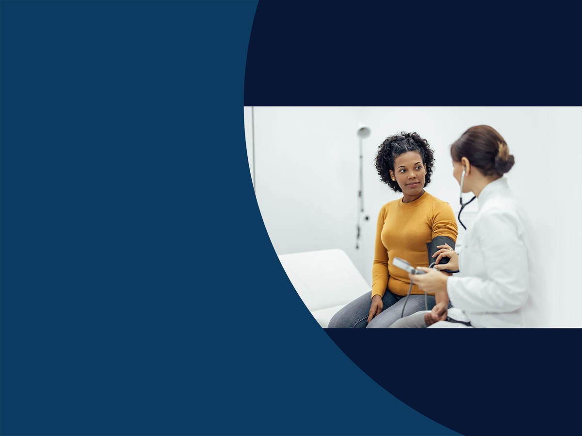 Doctor testing a patient's blood pressure