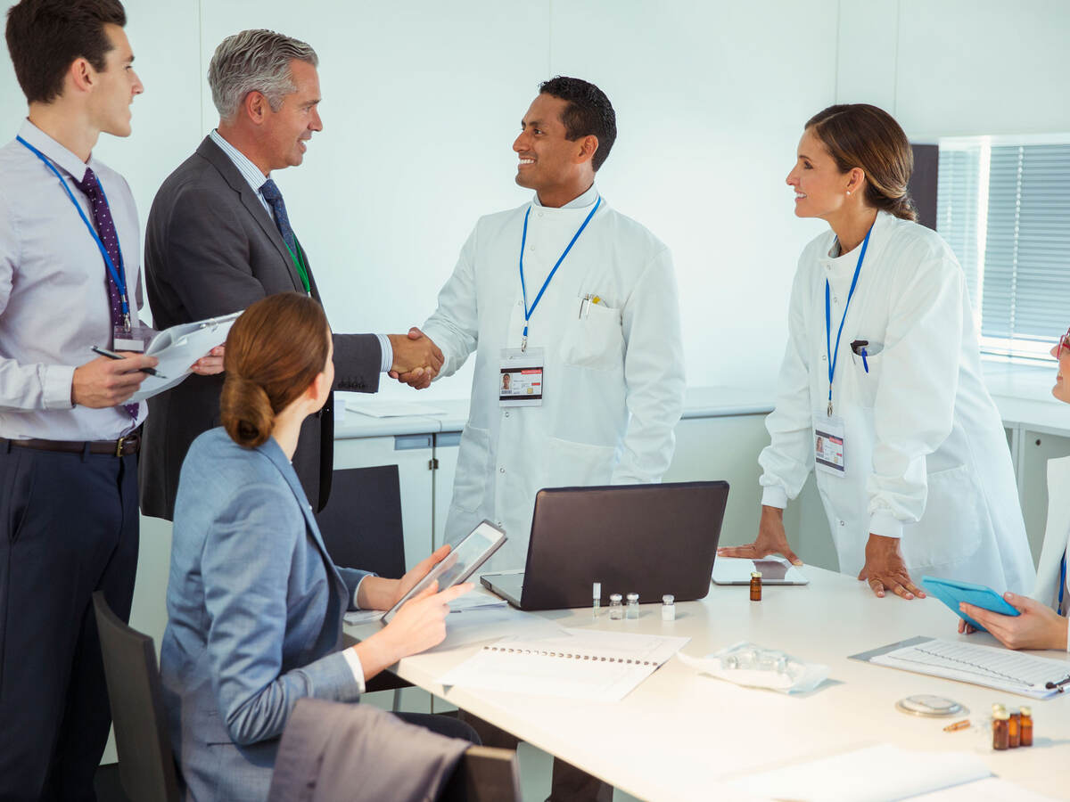 A meeting between business professionals and medical professionals