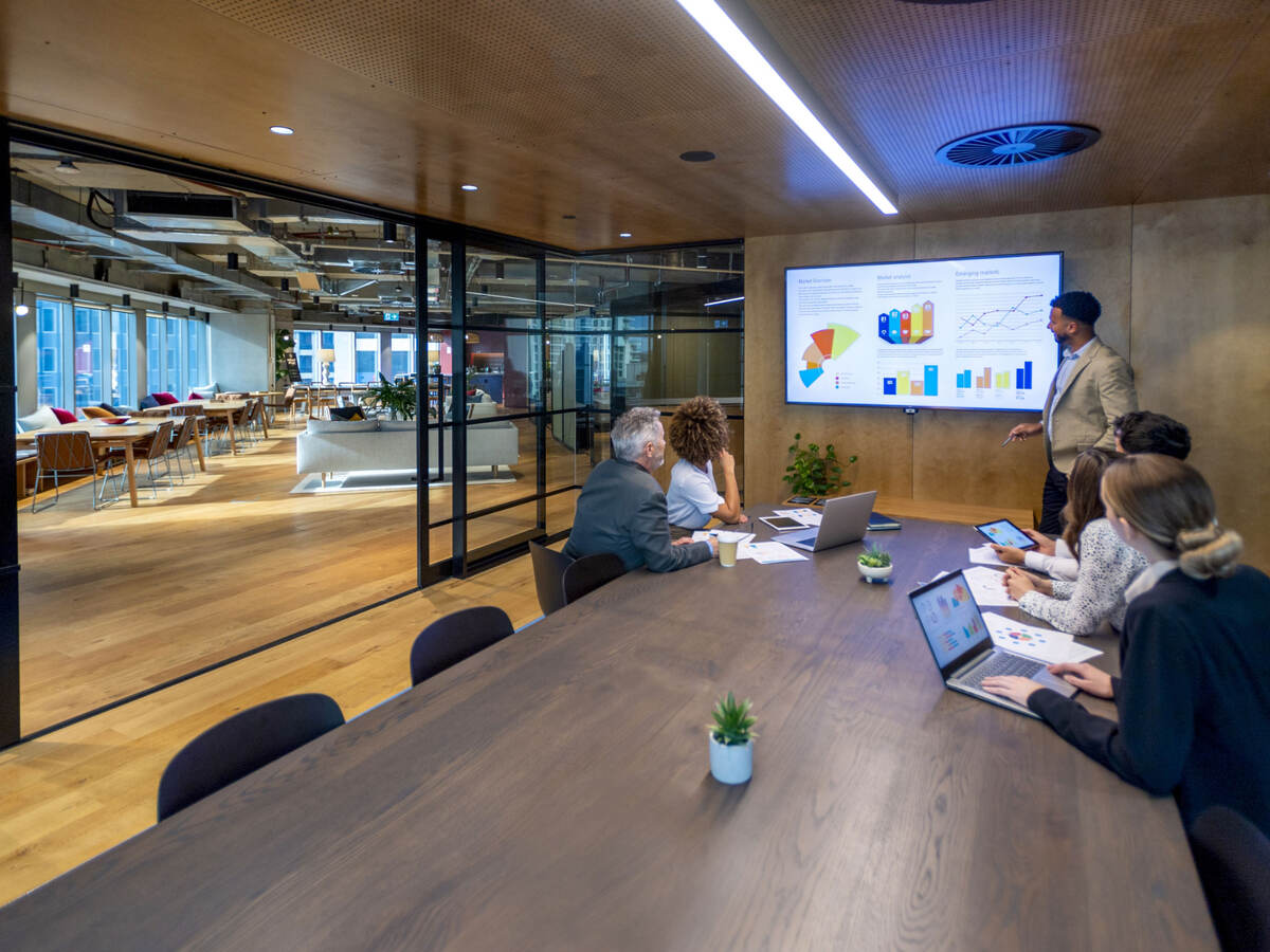 Group of colleagues having a meeting in a contemporary office setting