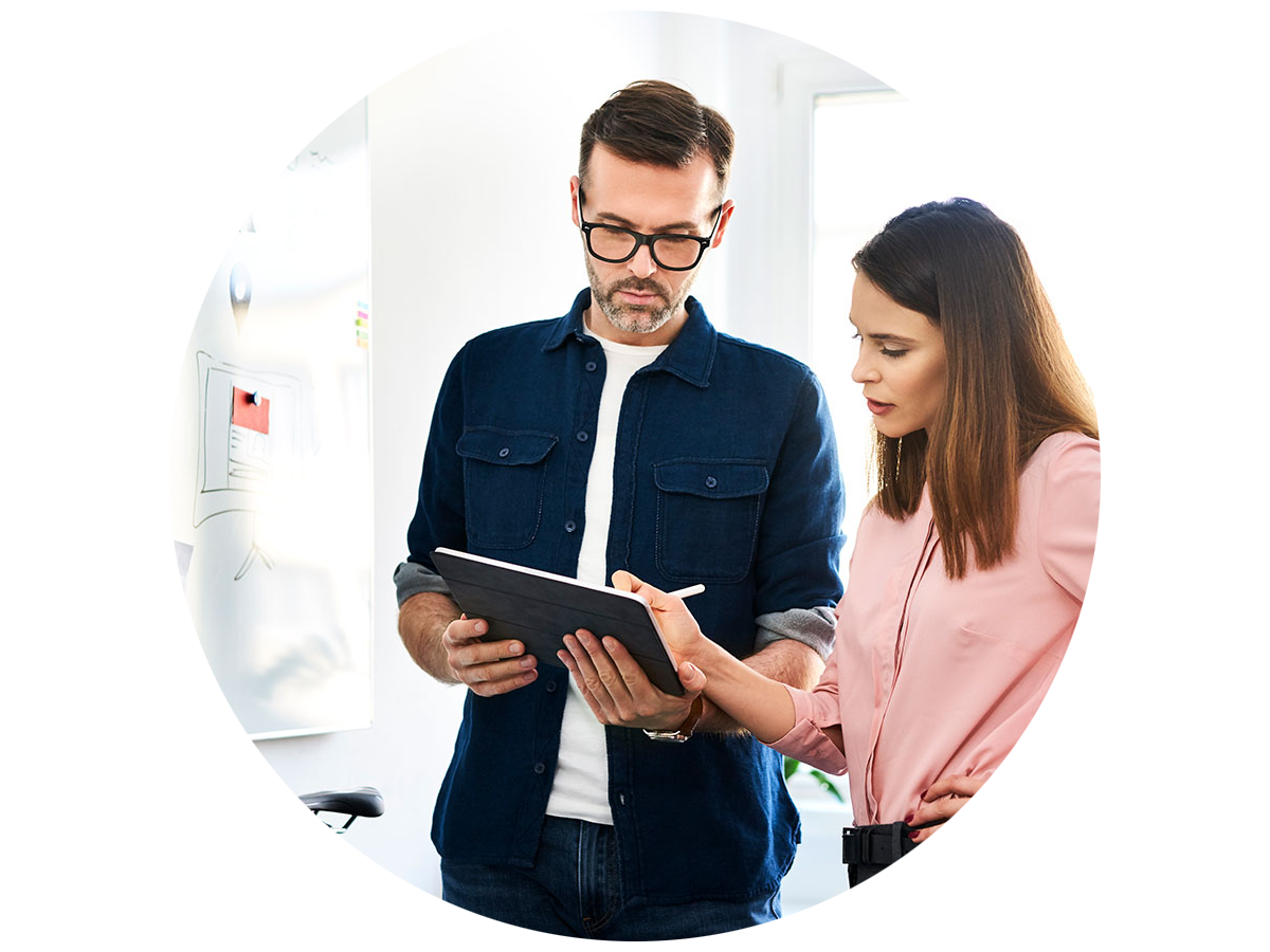Two people collaborating on a new design on a tablet