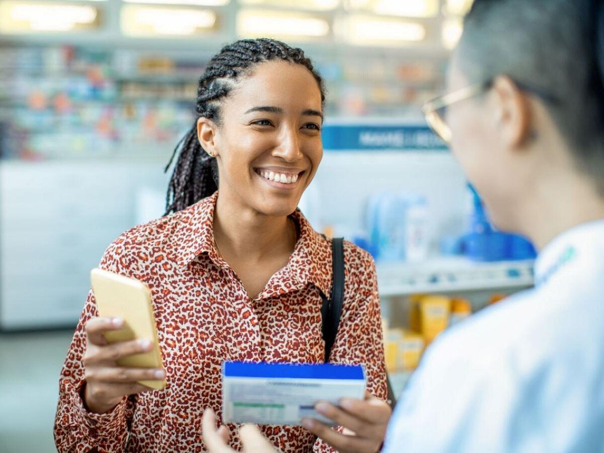 woman buying pharmacy product