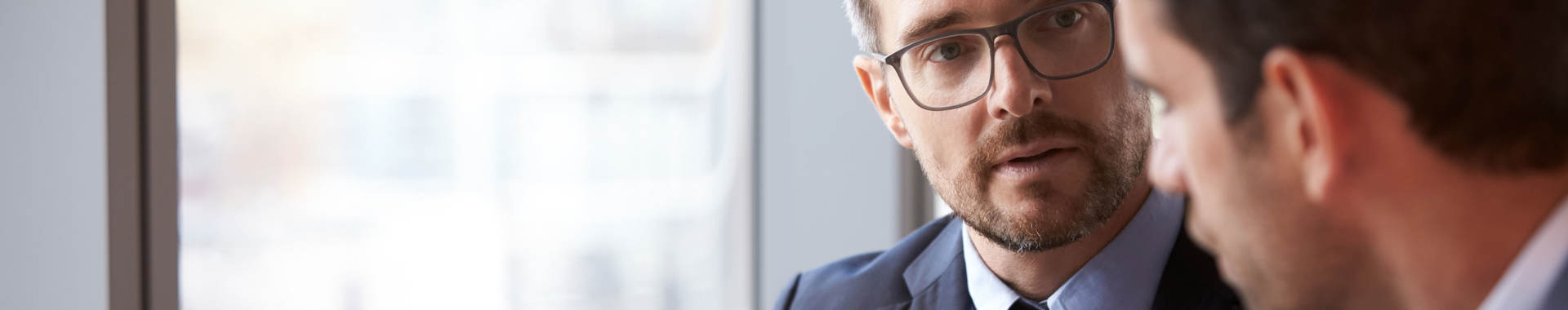 Two people in an office looking at each other