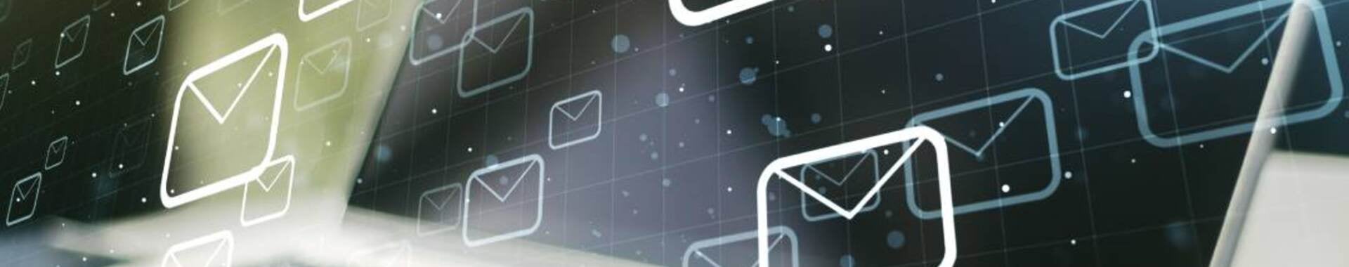 Laptop with email icons graphically overlaid