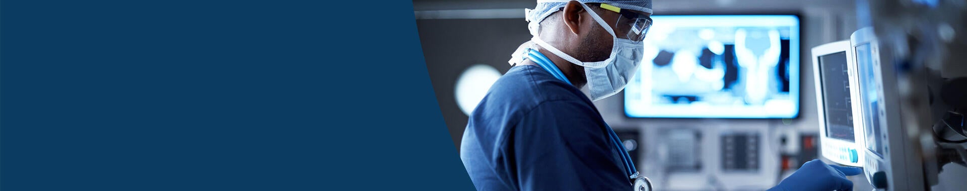 Surgeon looking at a health monitor