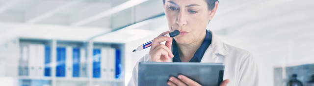 Scientist reviewing data on a tablet