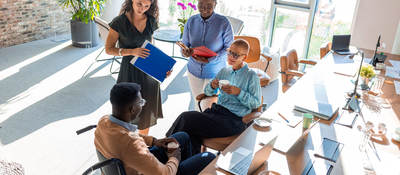 Two people in an office having a discussion