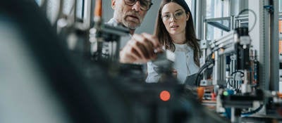 People in a lab testing components