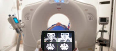 Doctor viewing MRI results on a tablet