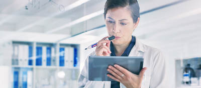 Scientist reviewing data on a tablet