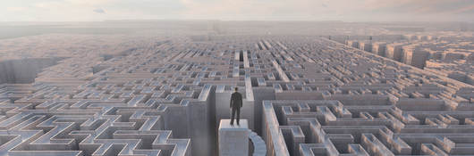 Person standing on top of a maze