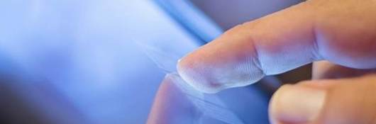 Close up of a finger using a touch screen
