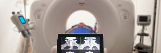 Doctor viewing MRI results on a tablet