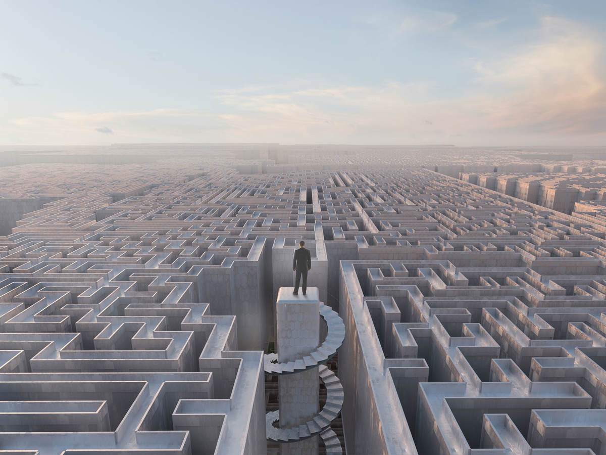 Person standing on top of a maze