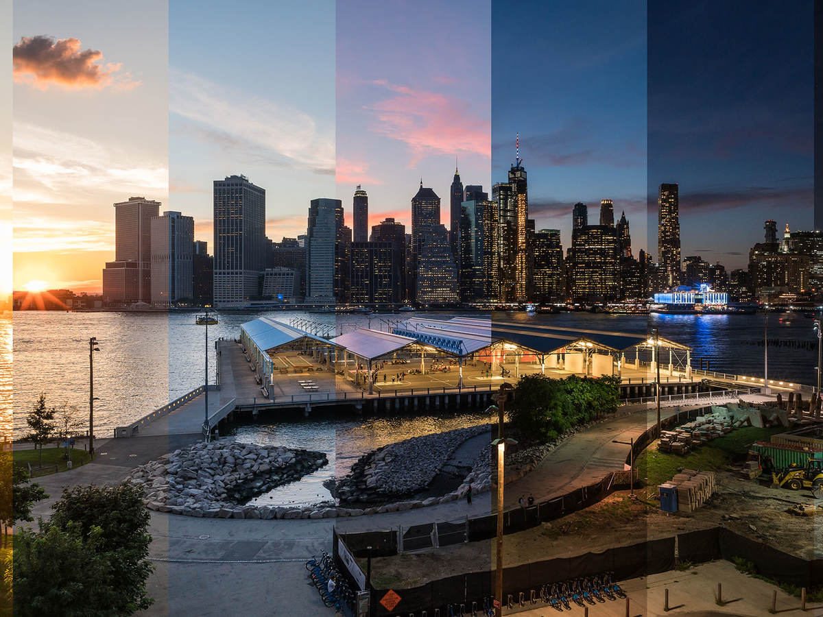 A picture of a city skyline where each fifth of the picture is a different time of day