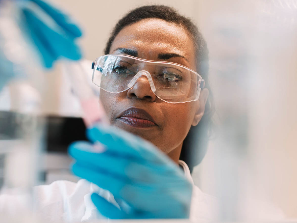 Lab technician filling a syringe