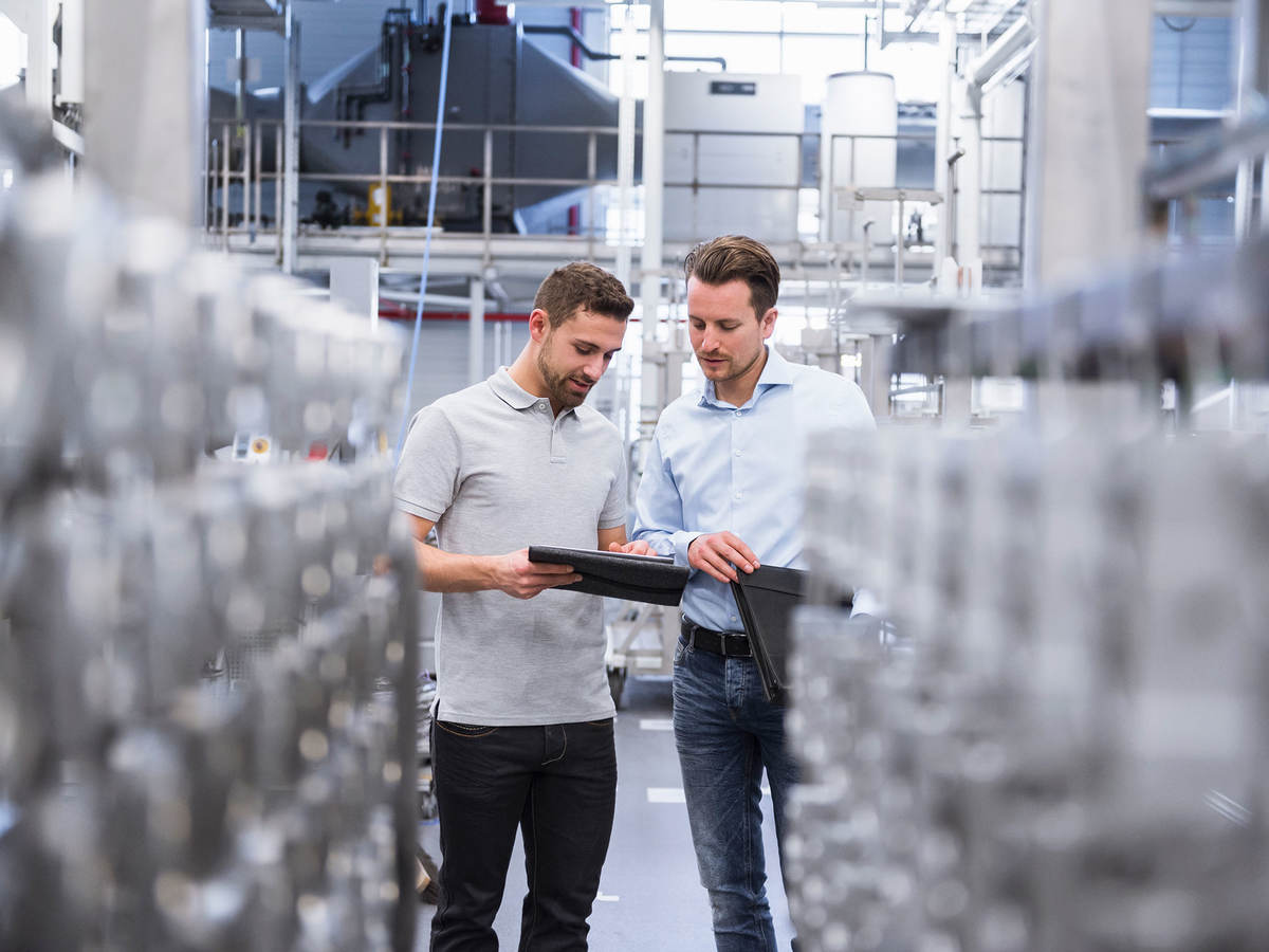Two people comparing notes in a lab